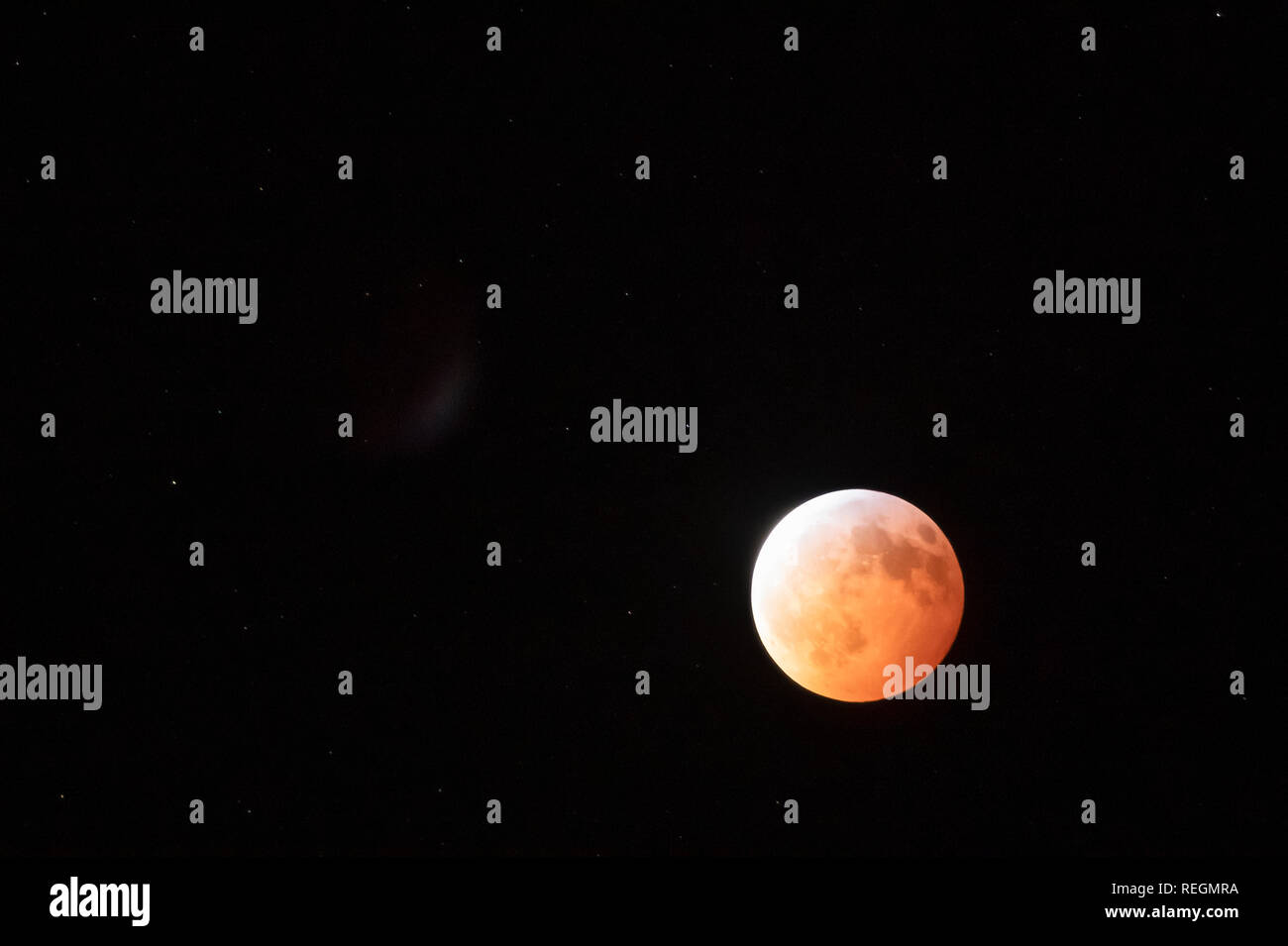 Lunar Eclipse on full moon in night sky. Stock Photo