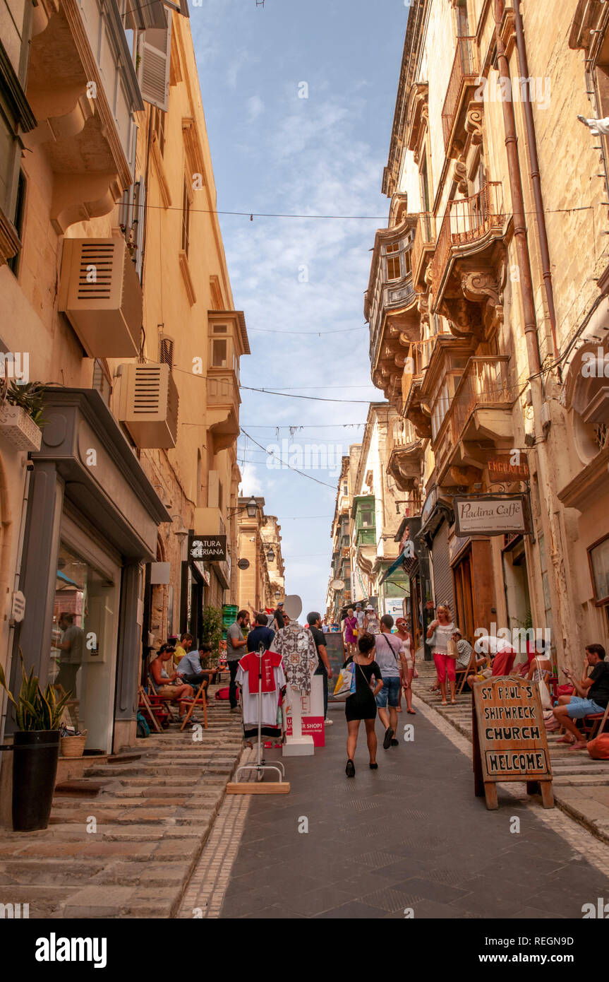 The lively, steep St. Lucia Street in central Valletta, the walled capital of Malta. Stock Photo