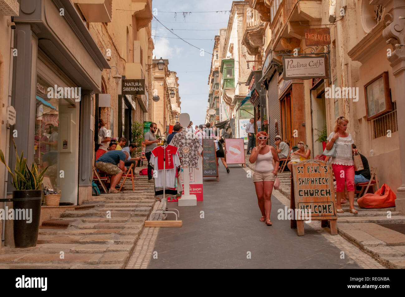 The lively, steep St. Lucia Street in central Valletta, the walled capital of Malta. Stock Photo