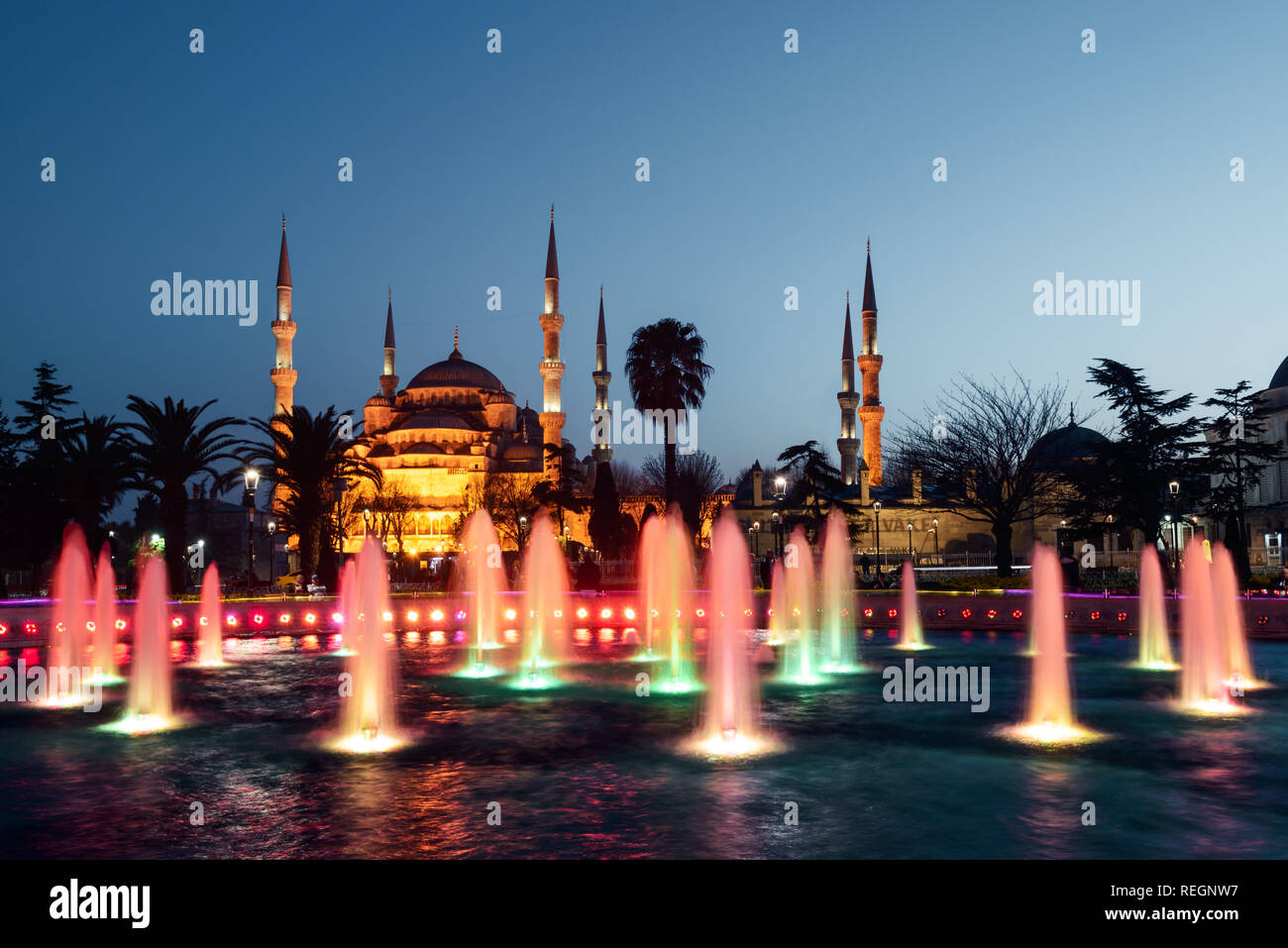 Fountain on Sultanahmet area in evening time. Multicolored streams against the background of the Blue mosque. Located place: Istambul, Turkey Stock Photo