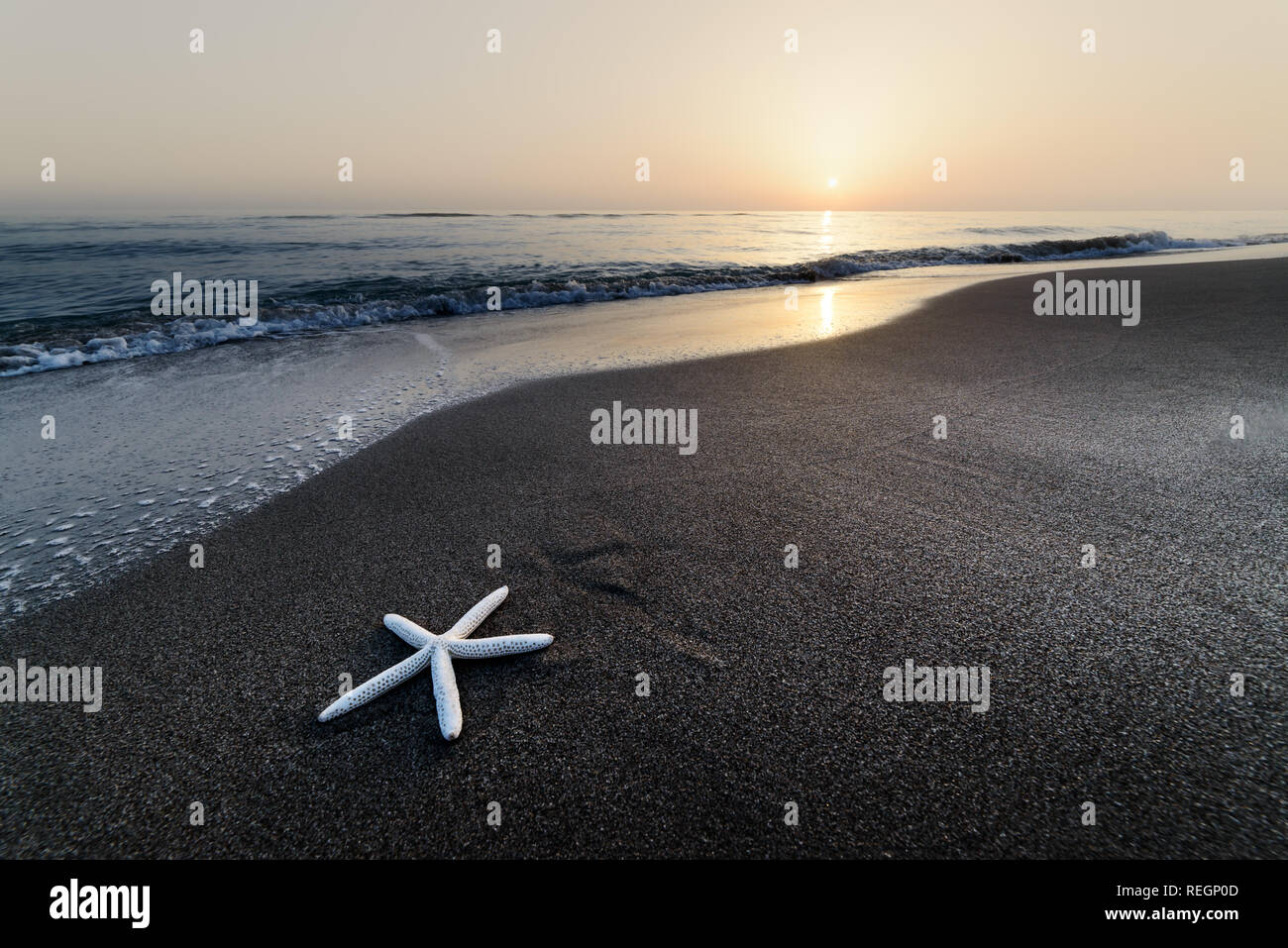 Amazing Mediterranean seascape with golden sand and blue waves. Summer vacations background Stock Photo