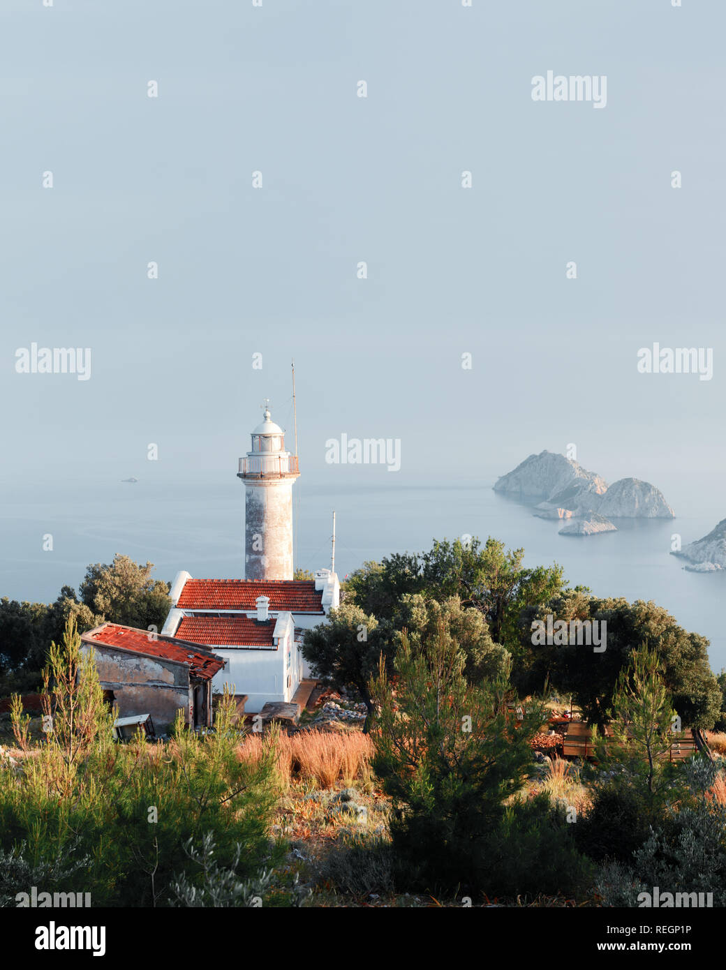 Picturesque scene with lighthouse on Gelidonya cape and small islands in Mediterranean sea. Landscape photography Stock Photo