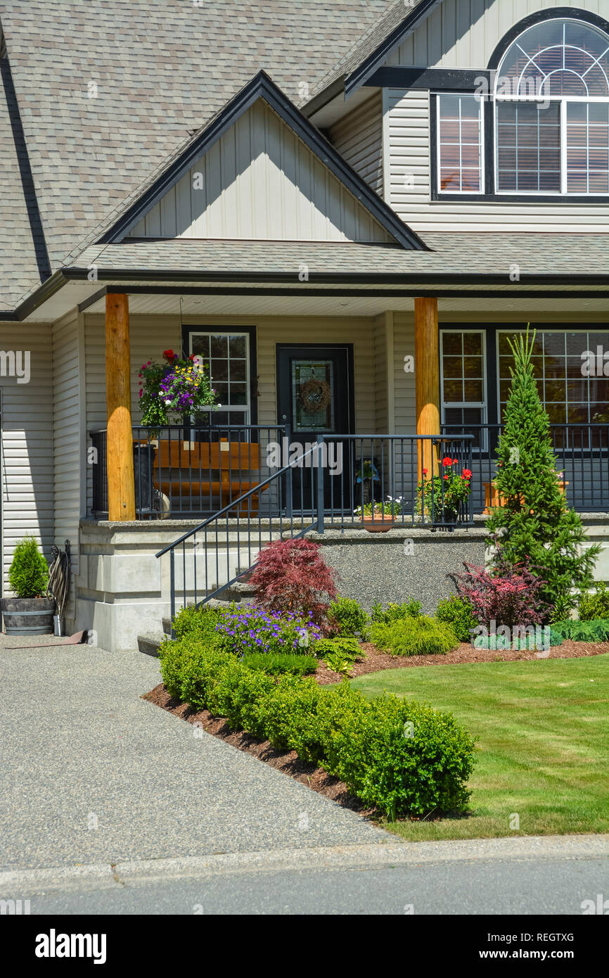 Entrance of suburban house with landscaping in front. Stock Photo