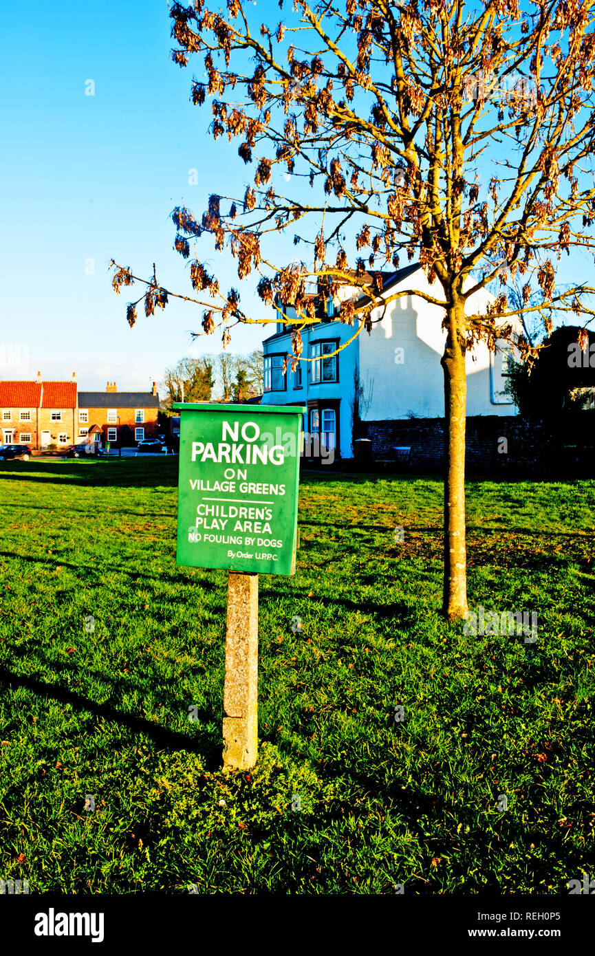 No Parking on Village green sign, Upper Poppleton, North Yorkshire, England Stock Photo