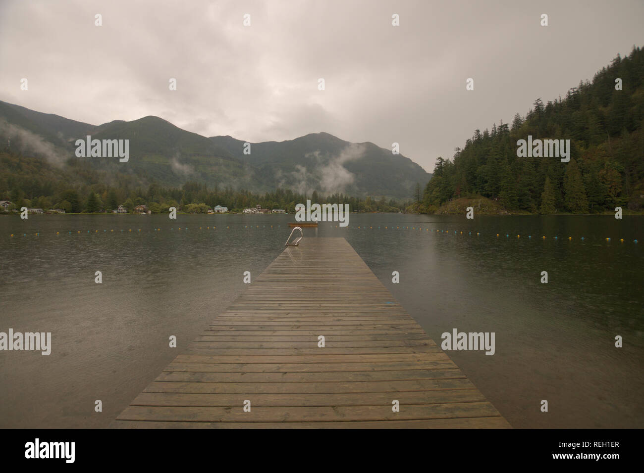 Rainy day on the dock at Lake Errock, Mission, BC, Canada Stock Photo