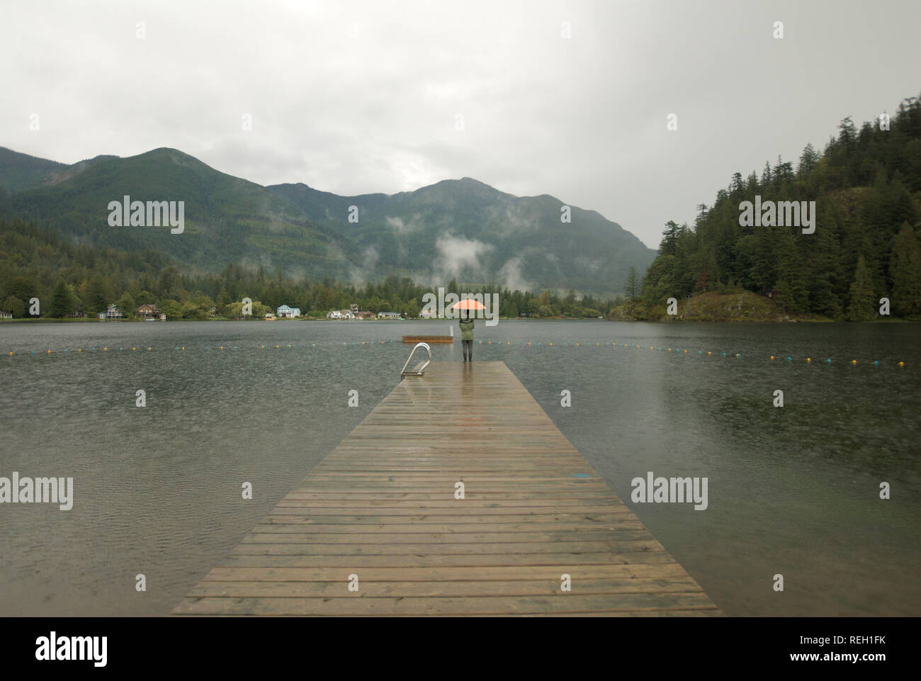 Rainy day on the dock at Lake Errock in Deroche, Mission, British Columbia, Canada Stock Photo