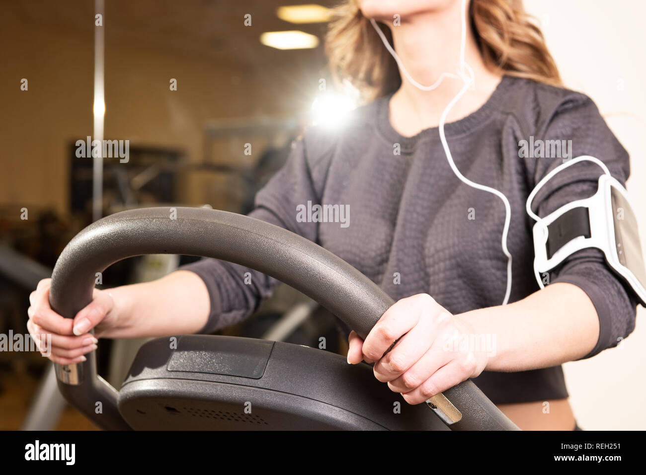 Fitness young girl on a stationary bike in a gym Stock Photo