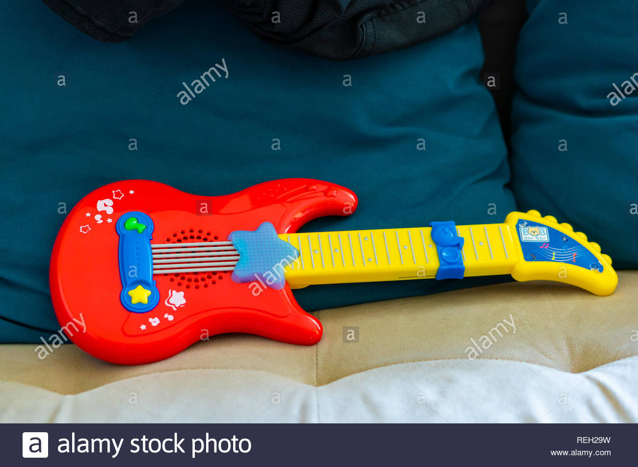 red toy guitar