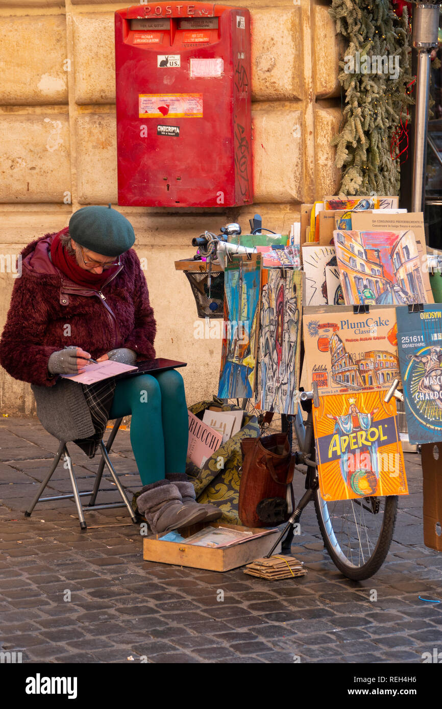 Italy Rome woman artist selling her little paintings by her bicycle near the Pantheon Stock Photo