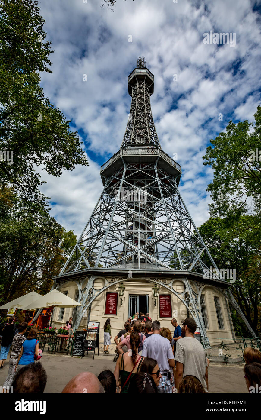 PRAGUE, CZECH REPUBLIC - AUGUST 28, 2015: Several tourists wait in line in to enter Petrin observation and lookup tower in Petrin park in West Prague, Stock Photo