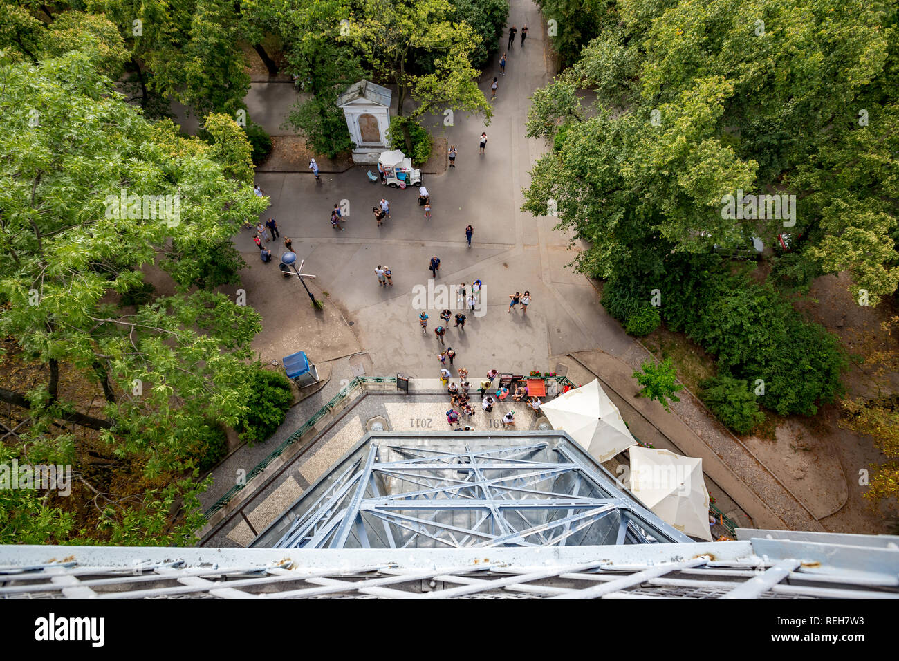PRAGUE, CZECH REPUBLIC - AUGUST 28, 2015: Several tourists wait to enter Petrin observation and lookup tower in Petrin park in West Prague, Czech Repu Stock Photo