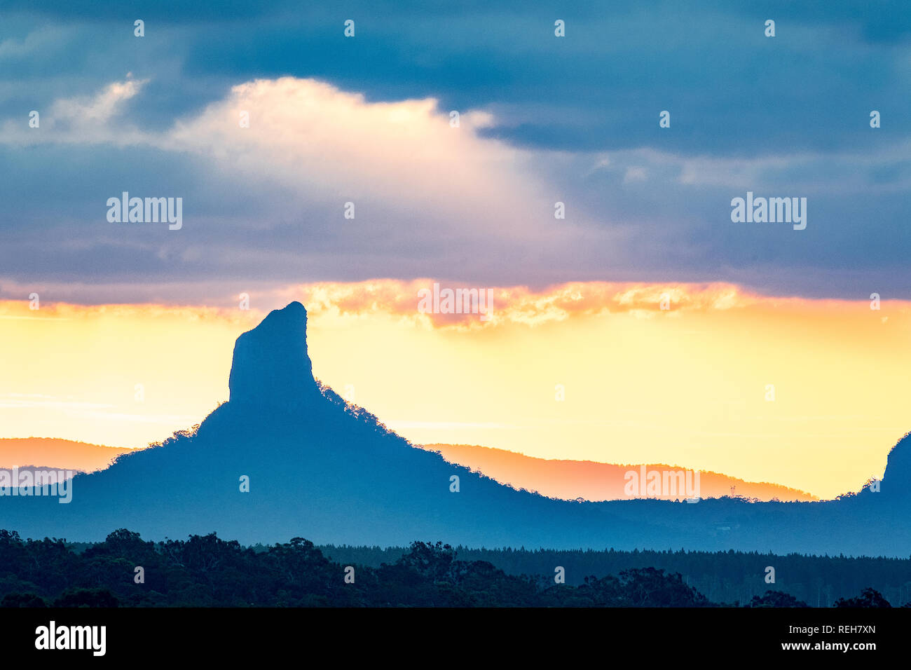 Sunset at Mount Coonowrin in the Glasshouse Mountains on the Sunshine Coast in Queensland, Australia Stock Photo