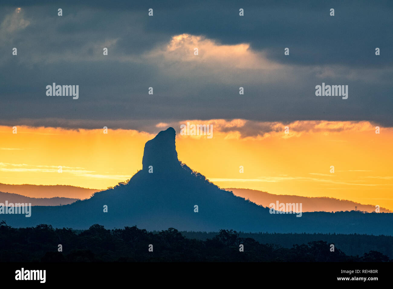 Sunset at Mount Coonowrin in the Glasshouse Mountains on the Sunshine Coast in Queensland, Australia Stock Photo