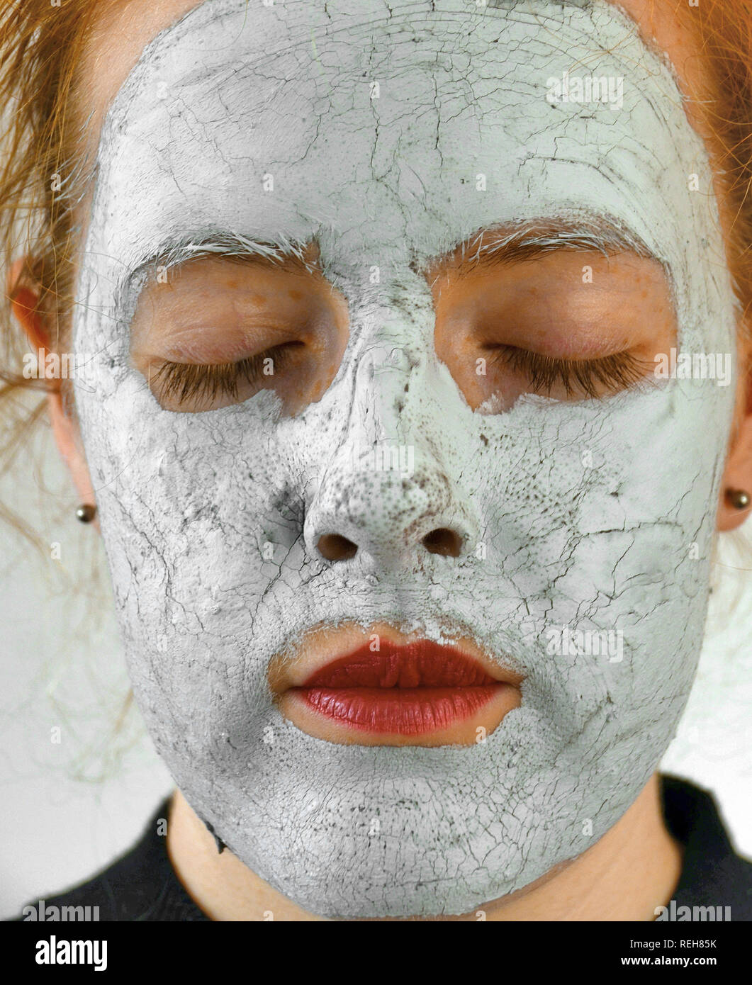 young teenage girl / woman with a beauty face mask Stock Photo