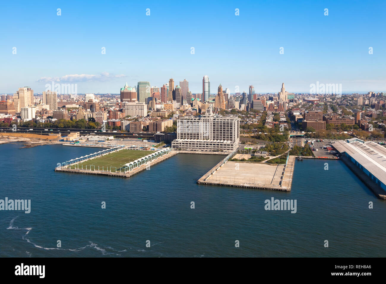 Houses of Brooklyn Heights on background of Hudson Upper Bay. Brooklyn Heights in New York NYC in USA at sunny day. Aerial helicopter view. Brooklyn H Stock Photo