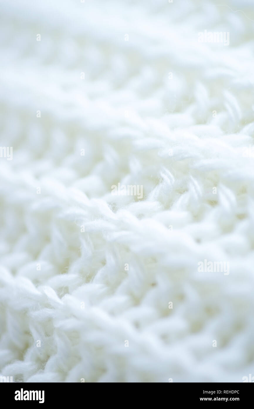 macro background white wool knitted textiles. Stock Photo