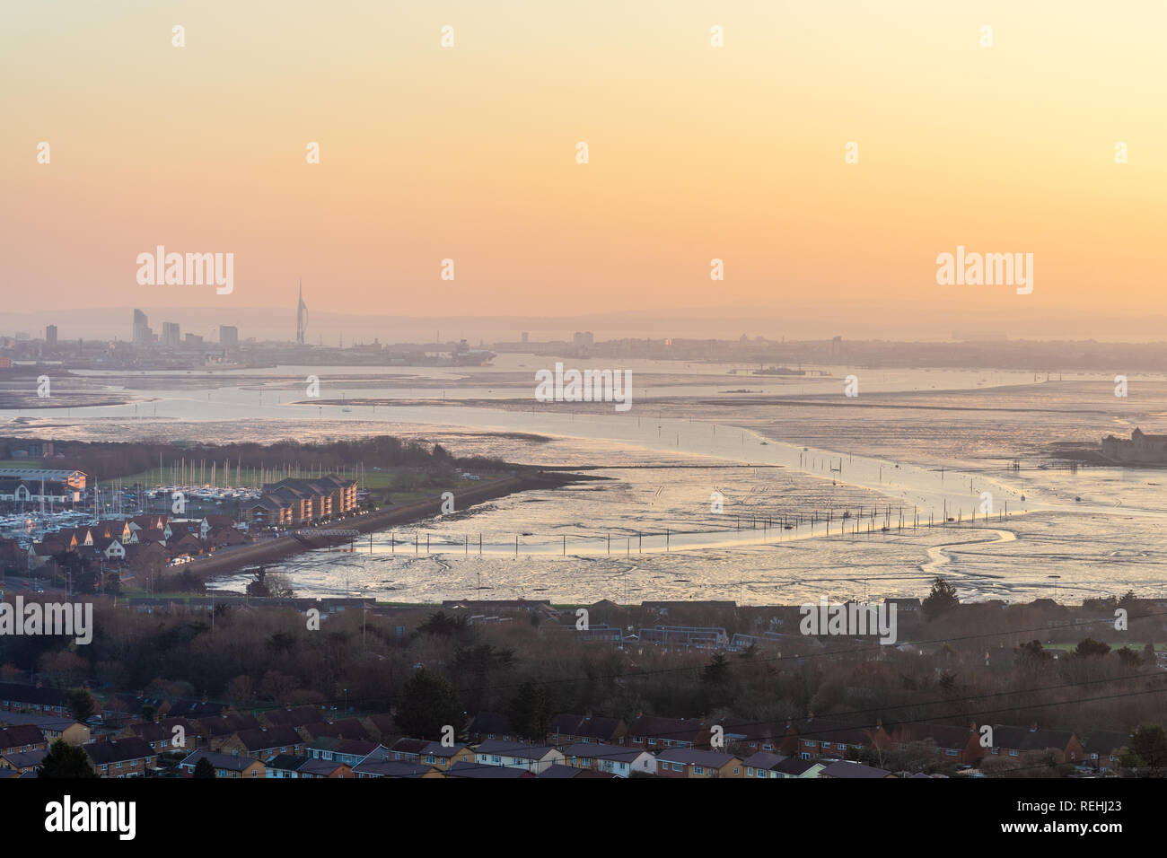 Sunset view from Portsdown Hill at dusk over Paulsgrove Lake and Port Solent and the Spnnaker Tower in the distance, Portsmouth skyline, Hampshire, UK Stock Photo