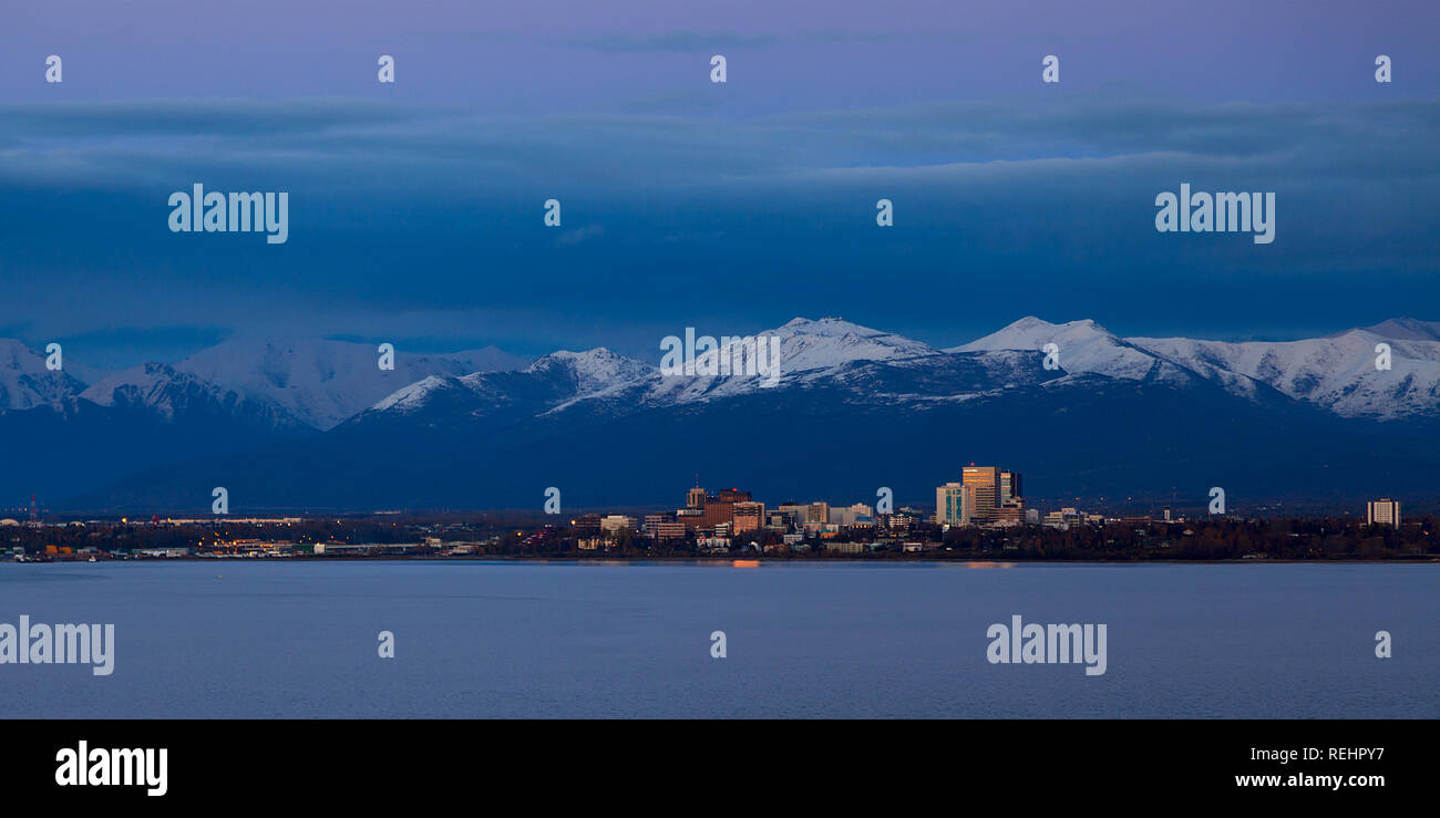 An evening sun illuminates downtown Anchorage, Alaska Stock Photo