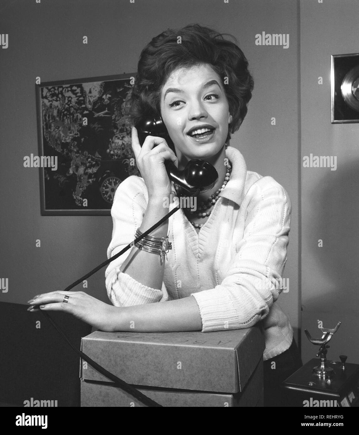 Woman in the 1950s. A young dark-haired woman speaking on the phone. She is the swedish singer Lill-Babs Svensson. 1938-2018. Ref 11-01-9 Stock Photo