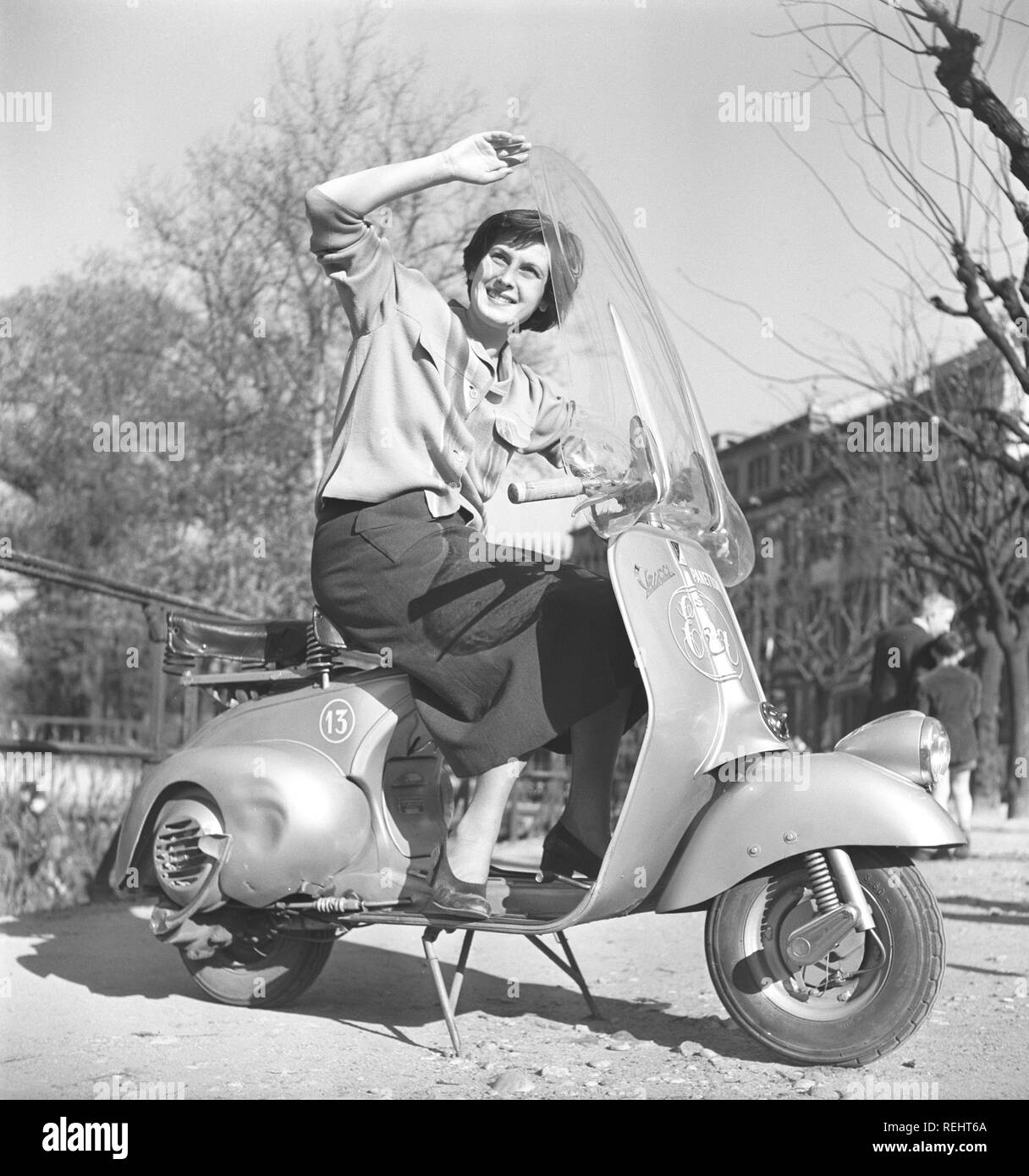 Driving in Italy in the 1950s. A young woman on a Vespa scooter in Milan  Italy 1950. Photo Kristoffersson Ref AY26-12 Stock Photo - Alamy