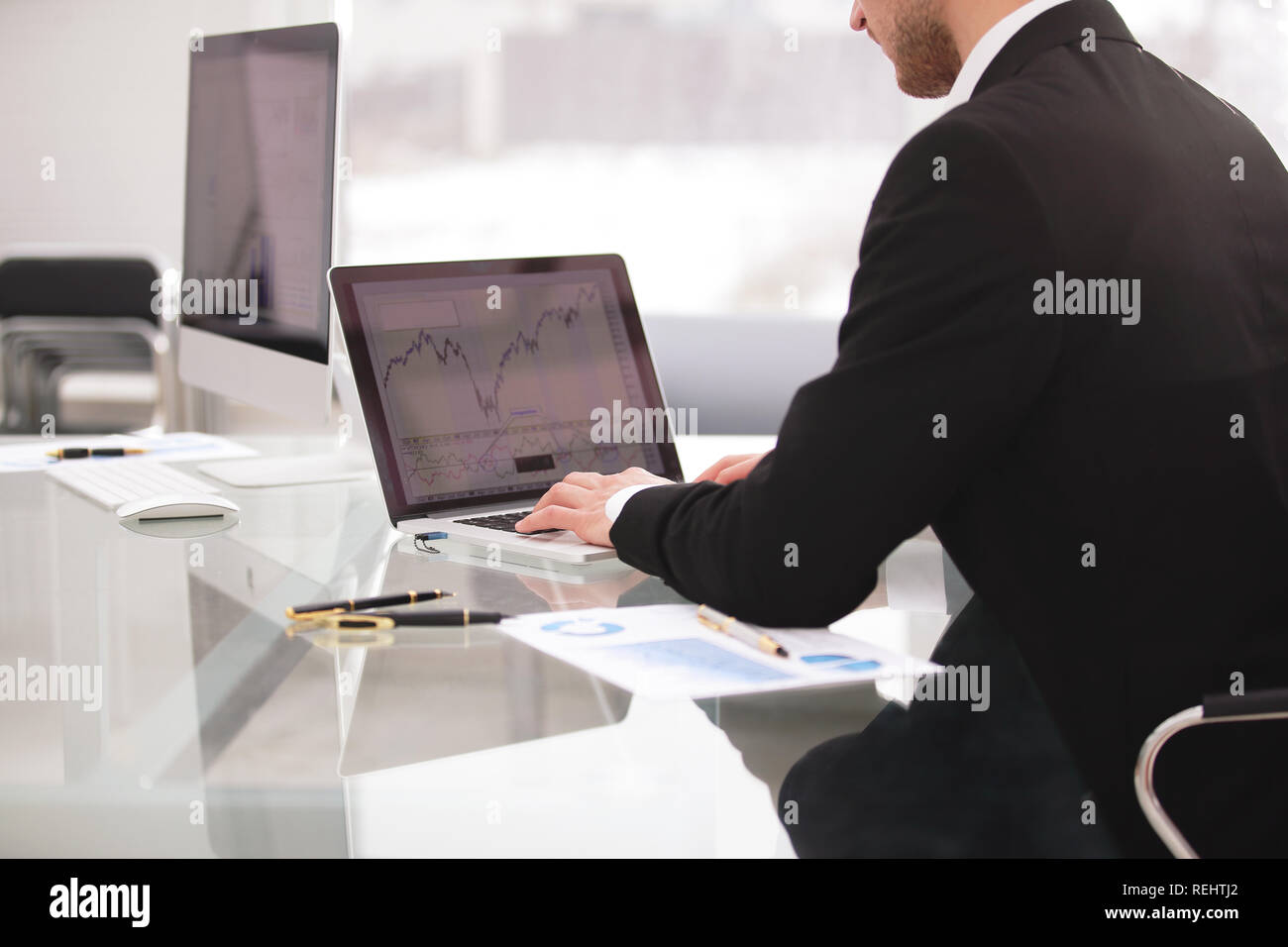 close up hands multitasking man using laptop connecting wifi Stock Photo