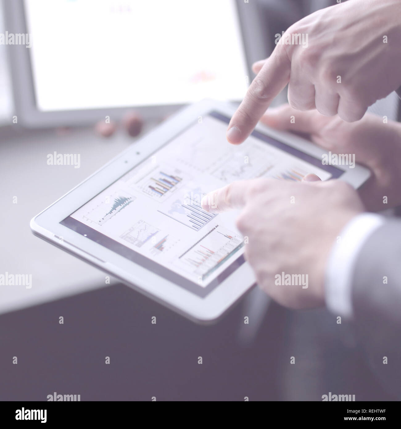 close up.businessman analyzing financial data using digital tablet ...