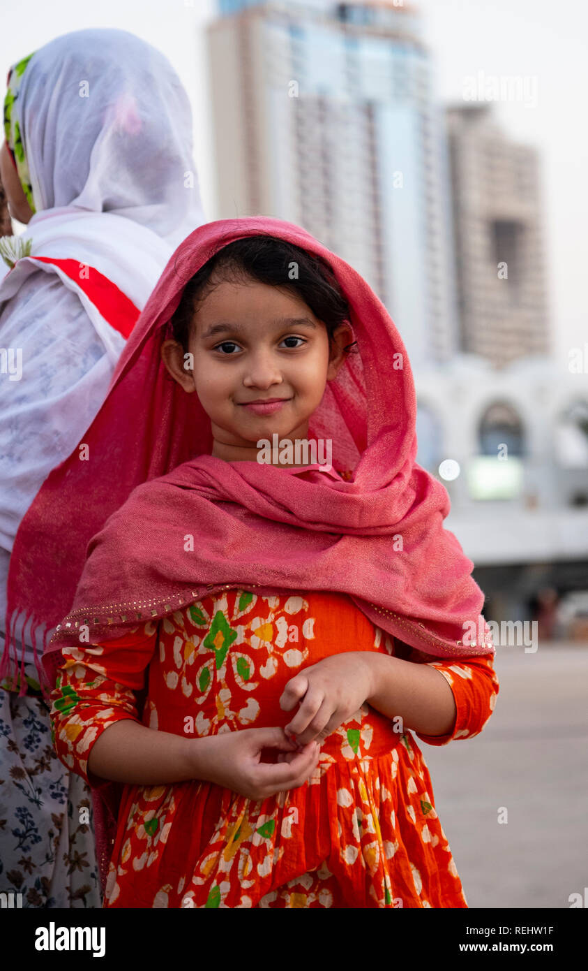 young Muslim pilgrim visiting Jeddah with her family for a Mecca pilgrimage Stock Photo