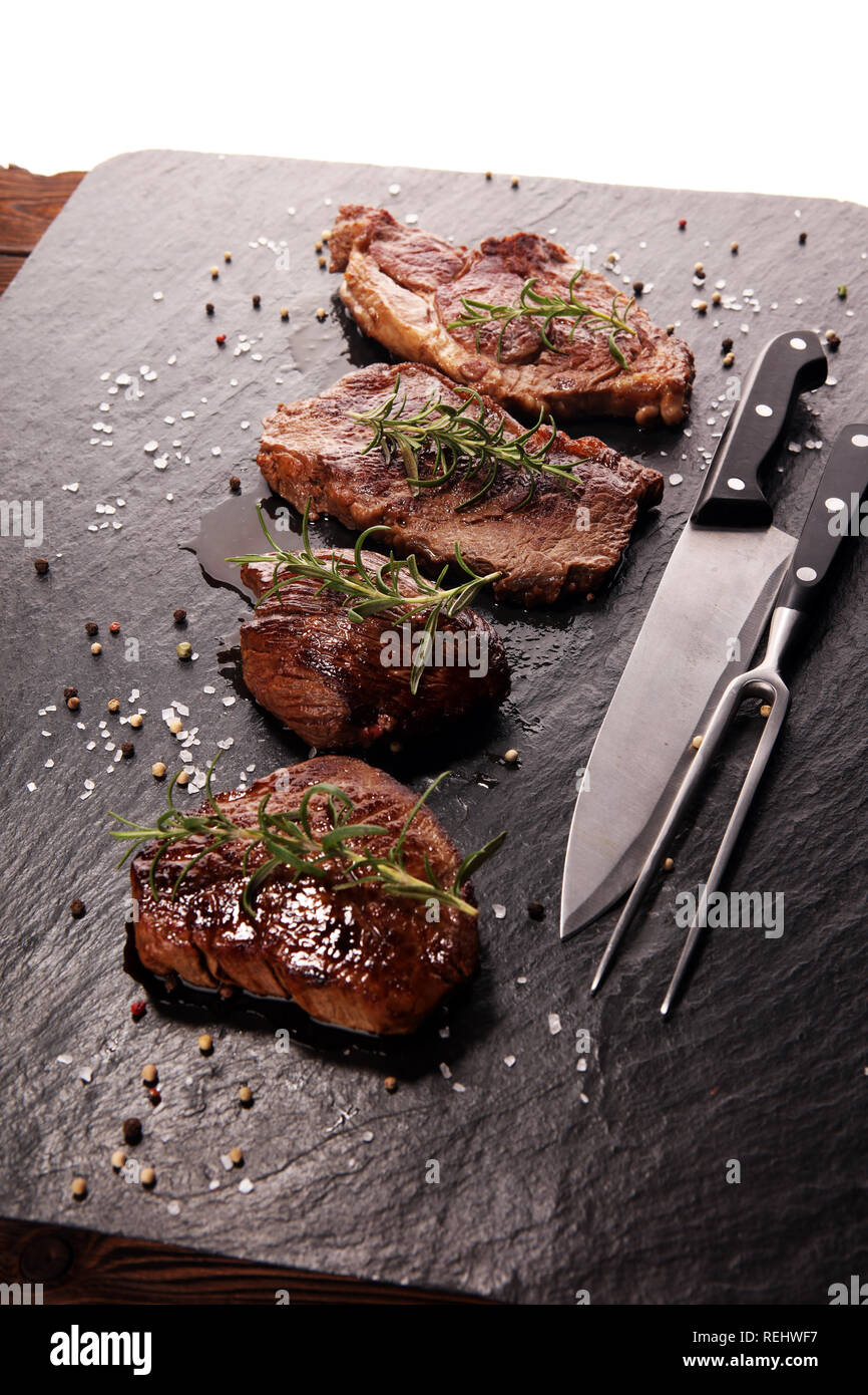 Barbecue Rib Eye Steak. Black Angus Prime meat steaks Machete, Striploin, Rib eye, Tenderloin fillet mignon Stock Photo