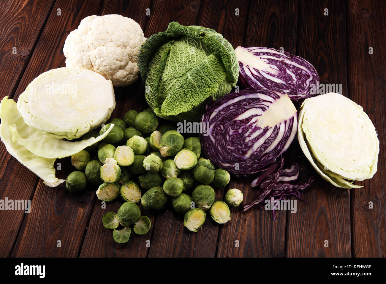 organic cabbage heads. Antioxidant balanced diet eating with red cabbage, white cabbage and savoy. cauliflower and Brussels sprouts Stock Photo