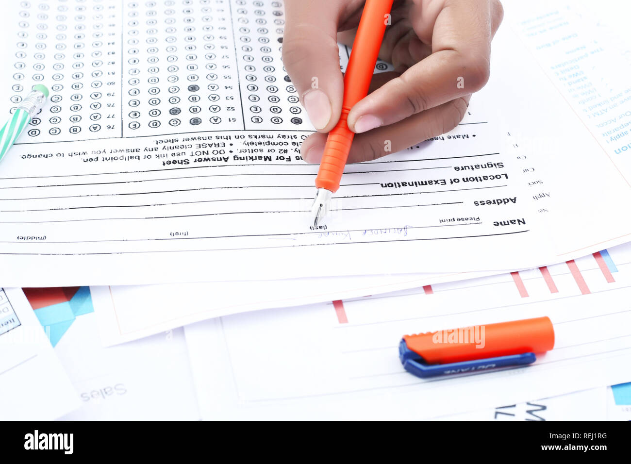 Man is filling omr sheet with fountain pen Stock Photo Alamy
