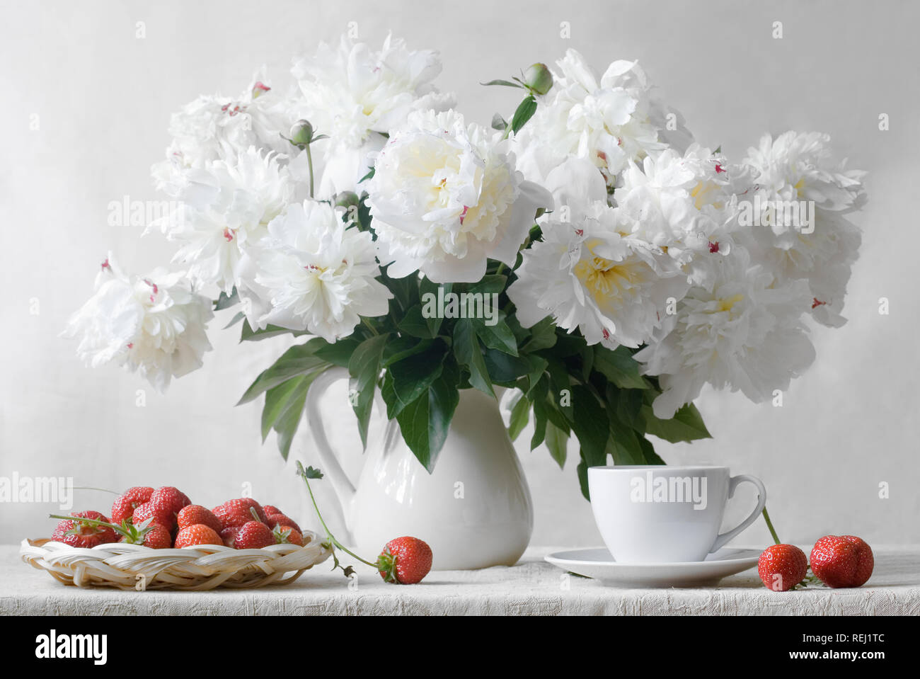 Still life with a bouquet of peonies on a white background Stock Photo ...