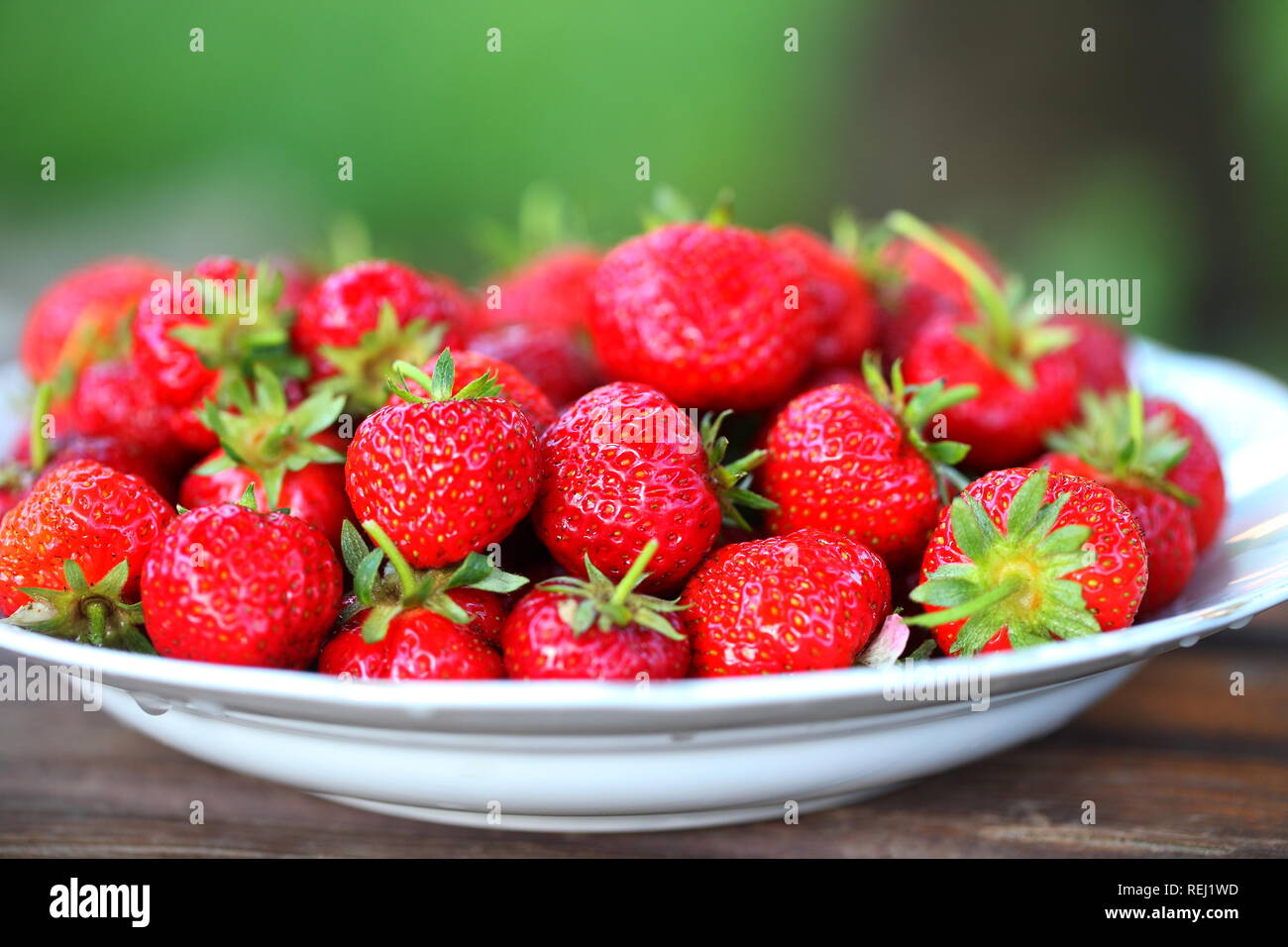 Still life with strawberries in the country Stock Photo - Alamy