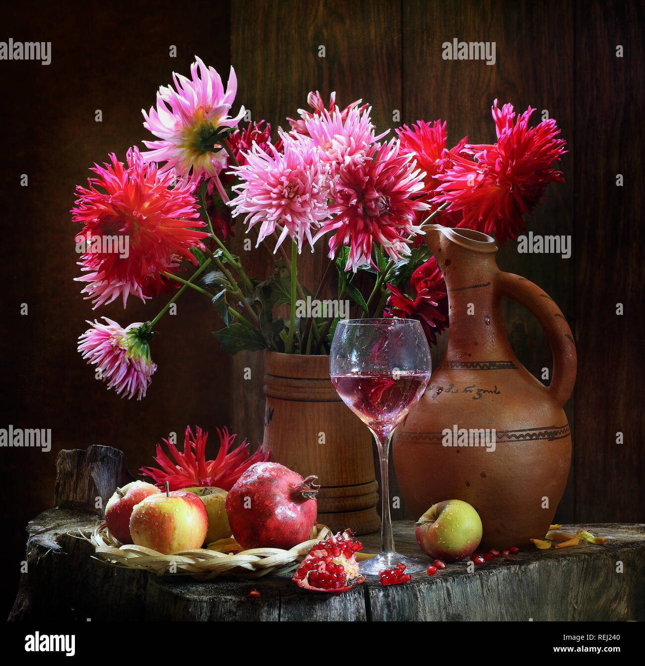 Still life with red wine and a bouquet of flowers Stock Photo - Alamy