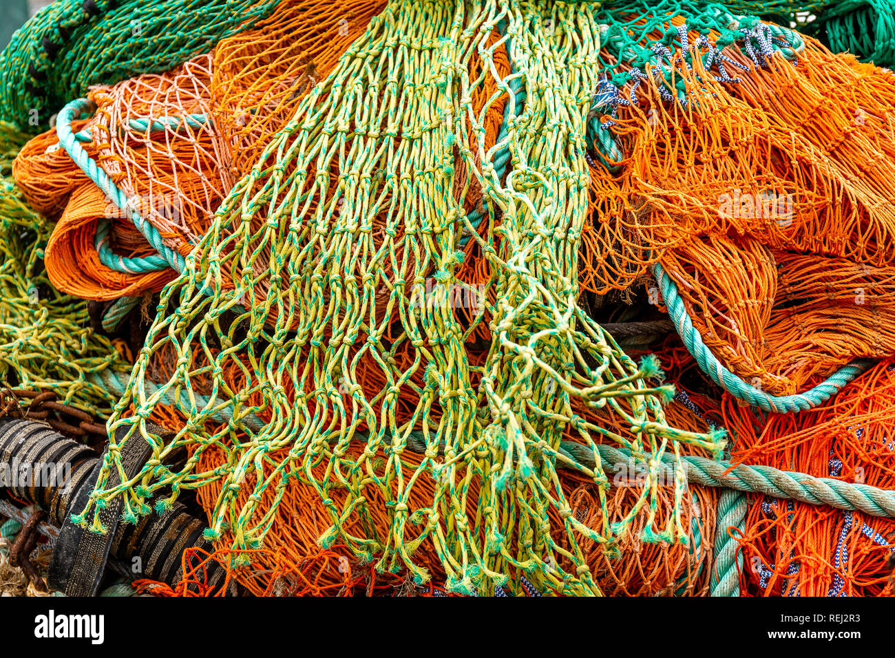 Fish Netting Rope Fishing Nets and Rope in bundle on harbour quayside Stock Photo - Alamy