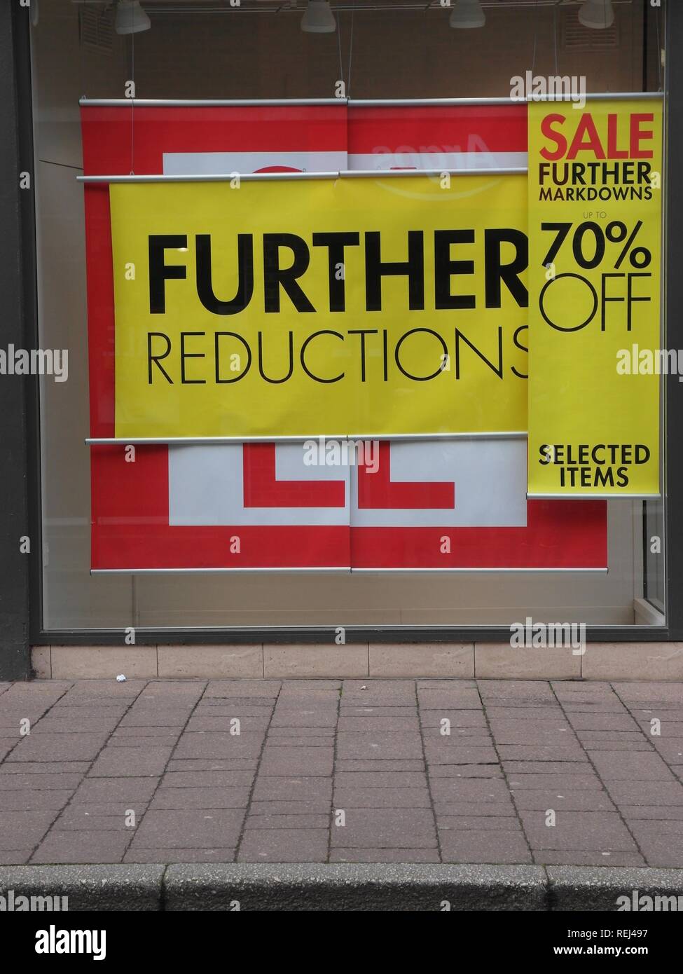 Big sale price reductions on high street as retailers slash prices discounting heavily during difficult trading conditions for shops. Stock Photo