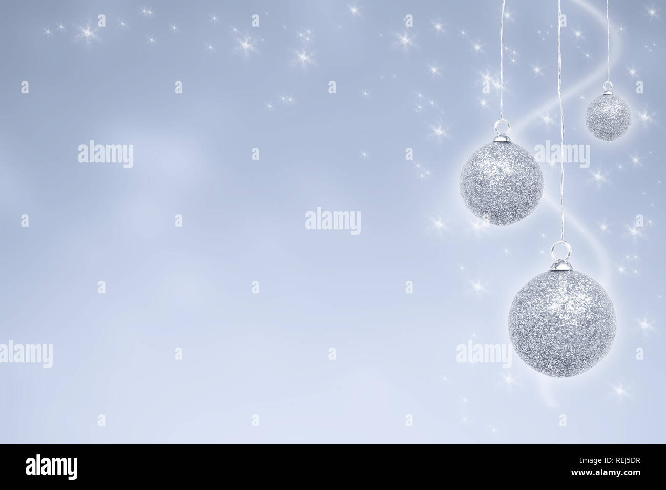 Silver christmas baubles in the snow hi-res stock photography and ...