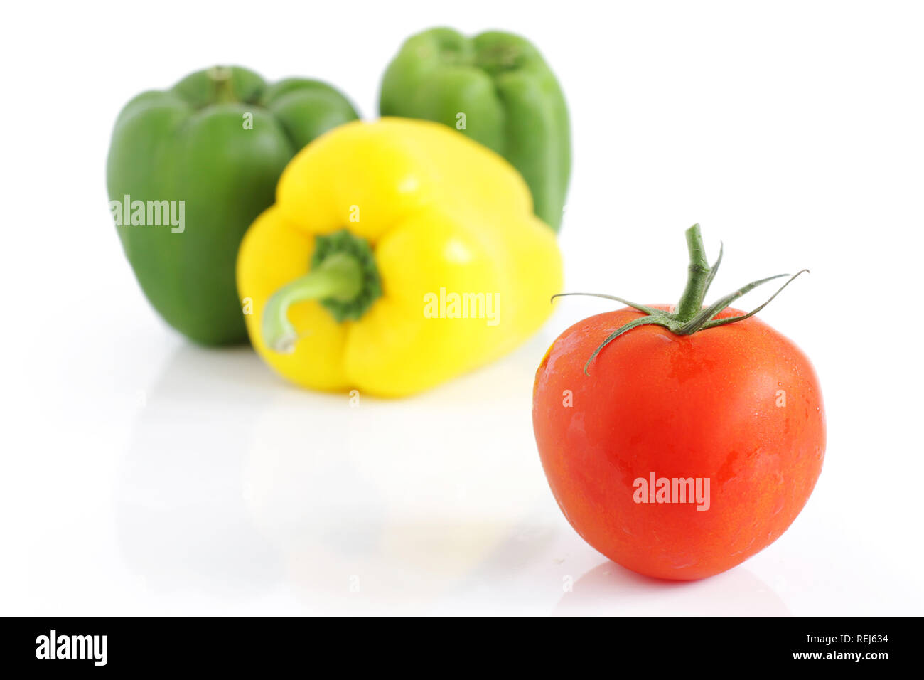 Fresh tomatoe and  peppers, isolated on white Stock Photo