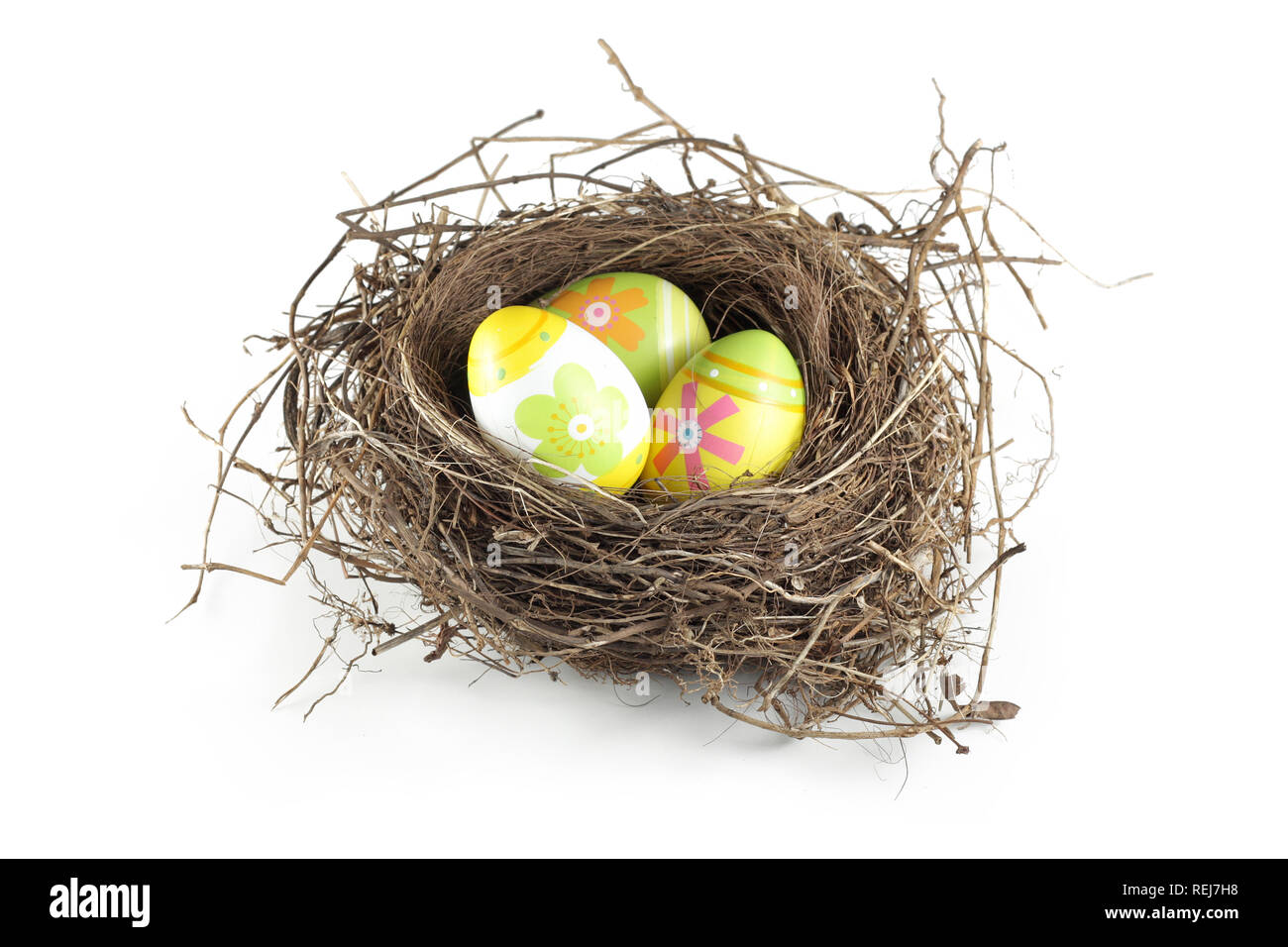 Easter eggs in nest on white background Stock Photo - Alamy