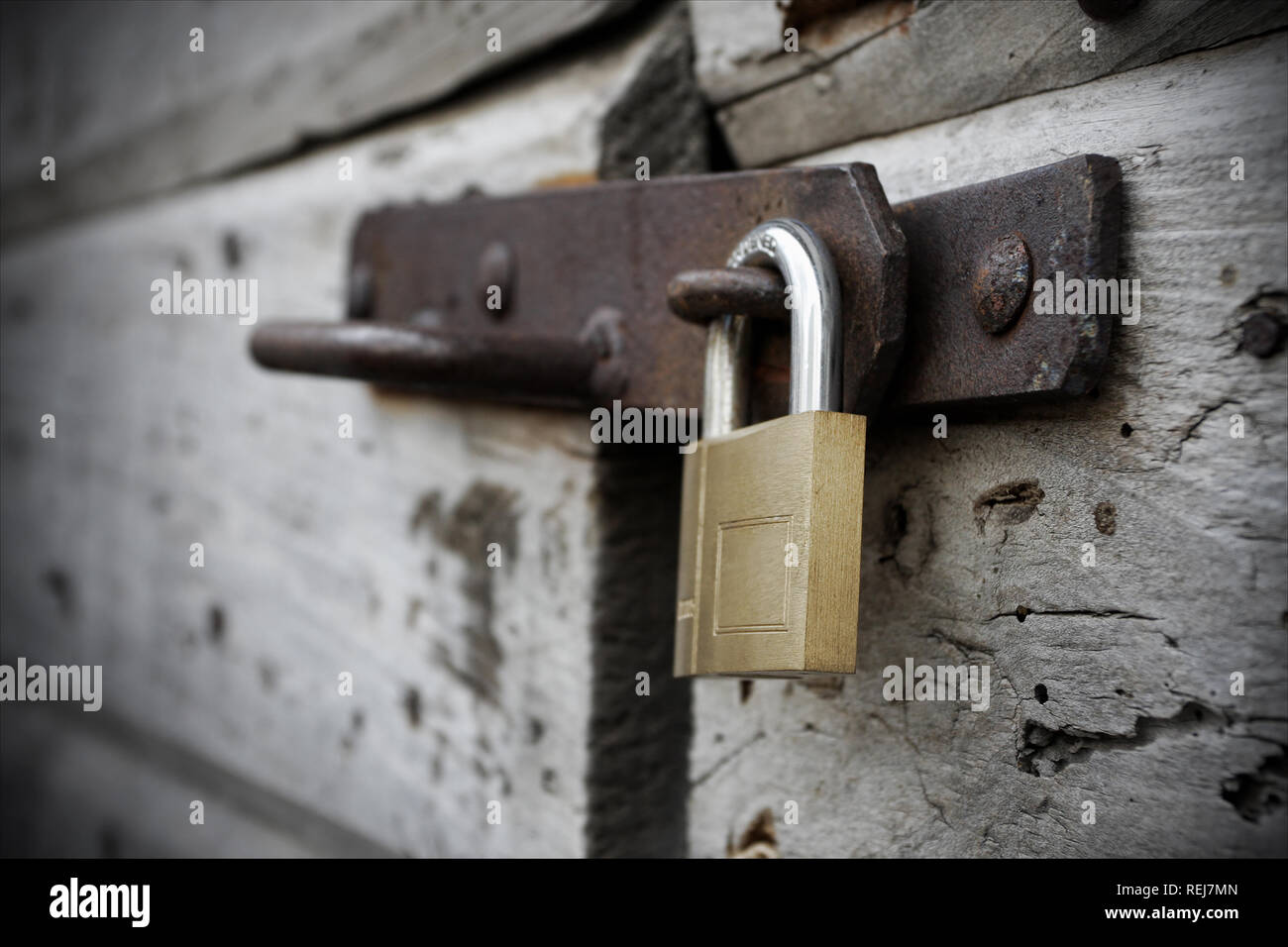 Lock Behind Behind the new lock and old wooden door Stock Photo - Alamy