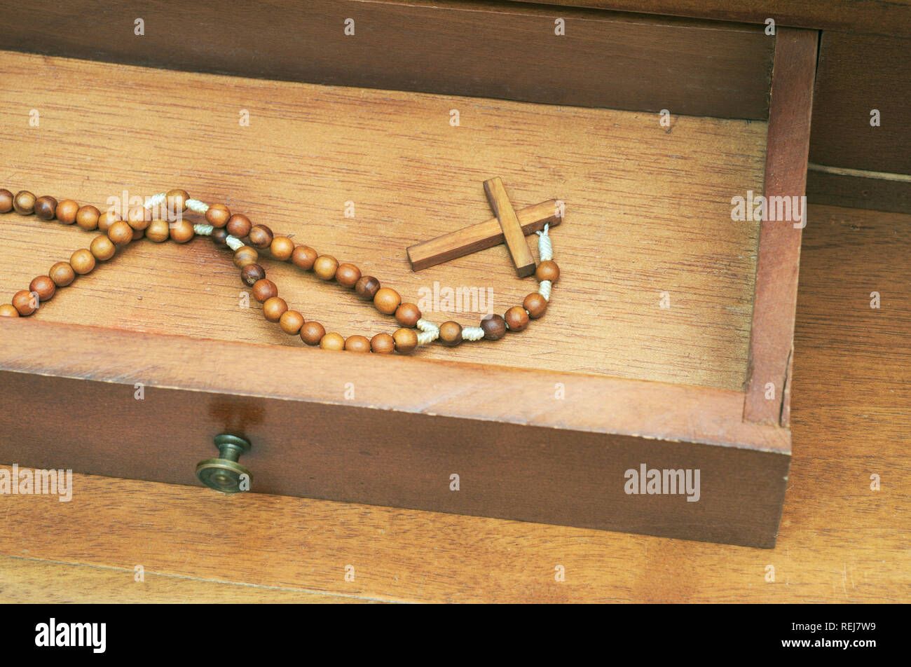 catholic rosary in open drawer Stock Photo