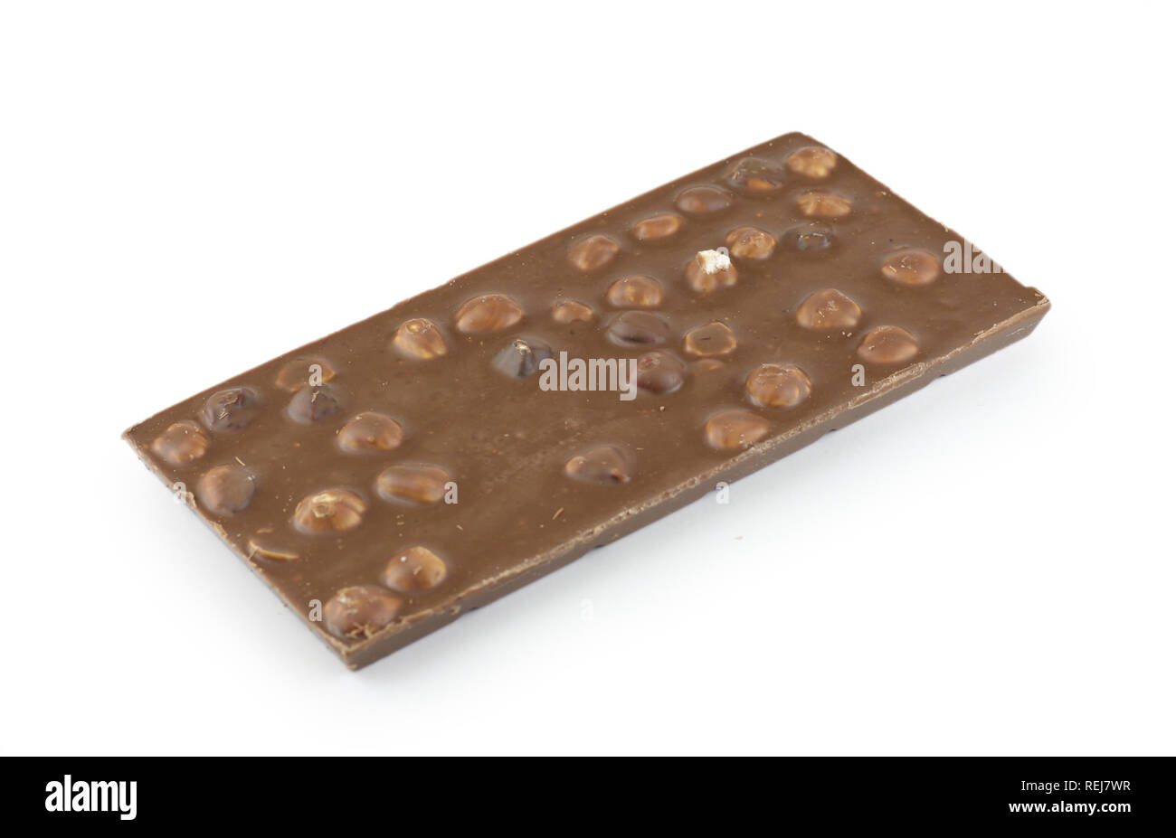 Milk chocolate with whole hazelnuts, isolated on white Stock Photo Alamy