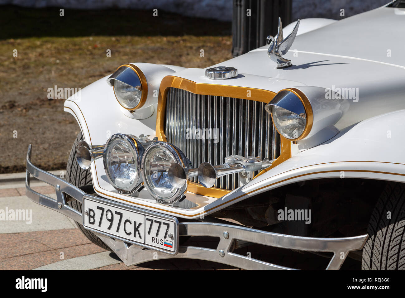 Very beautiful, sparkling in the sun car Packard limousine of white color. Fore view Stock Photo
