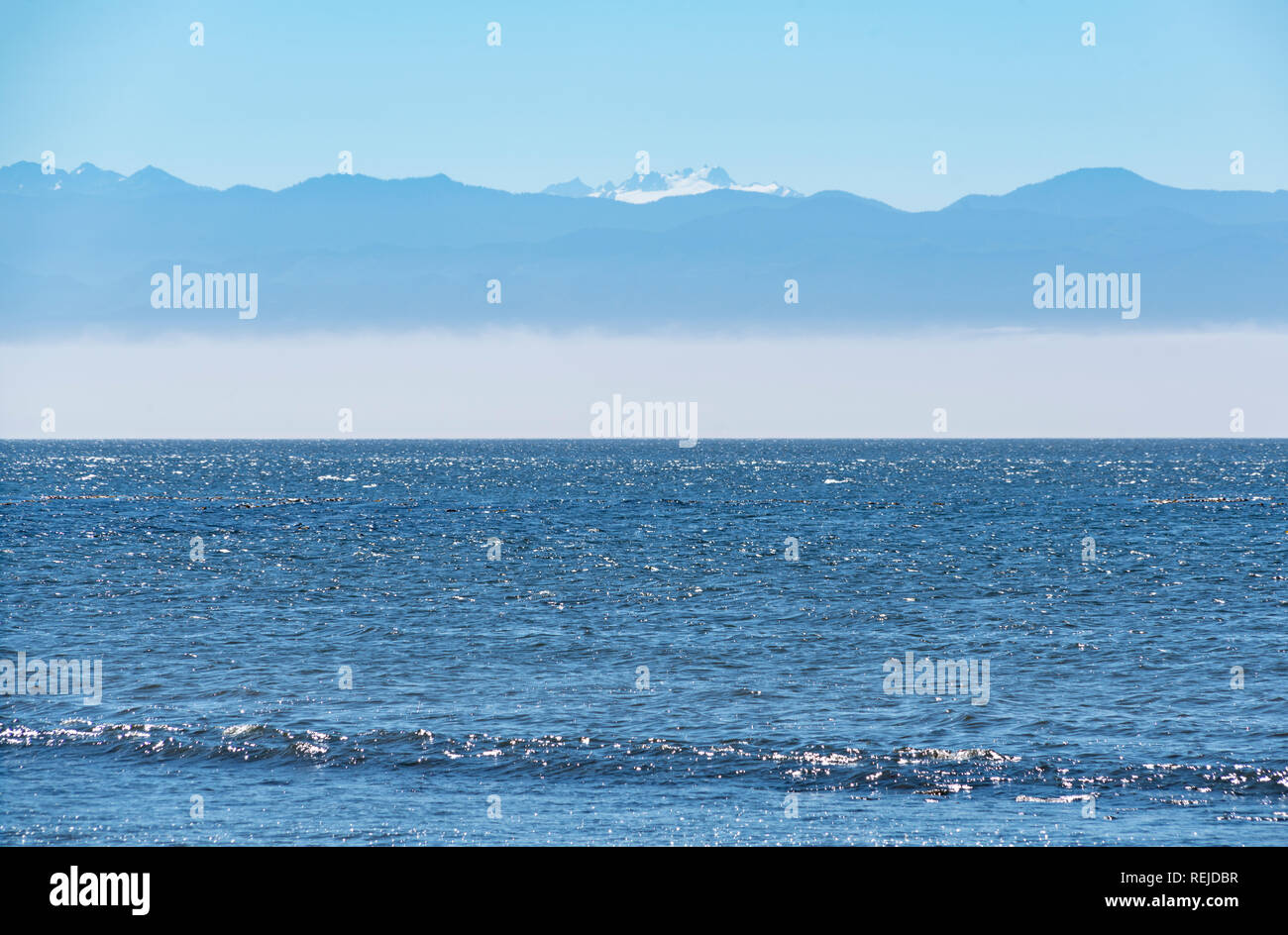 Sea, Mist & Mountains Stock Photo