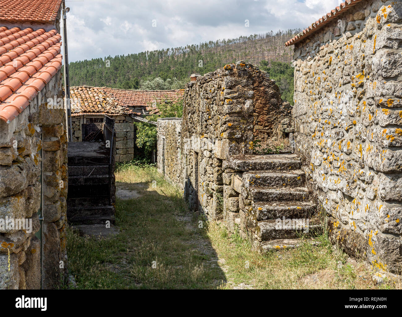 Staircase of a traditional local granite house of the rural architecture of the Beira Alta region in Portugal Stock Photo