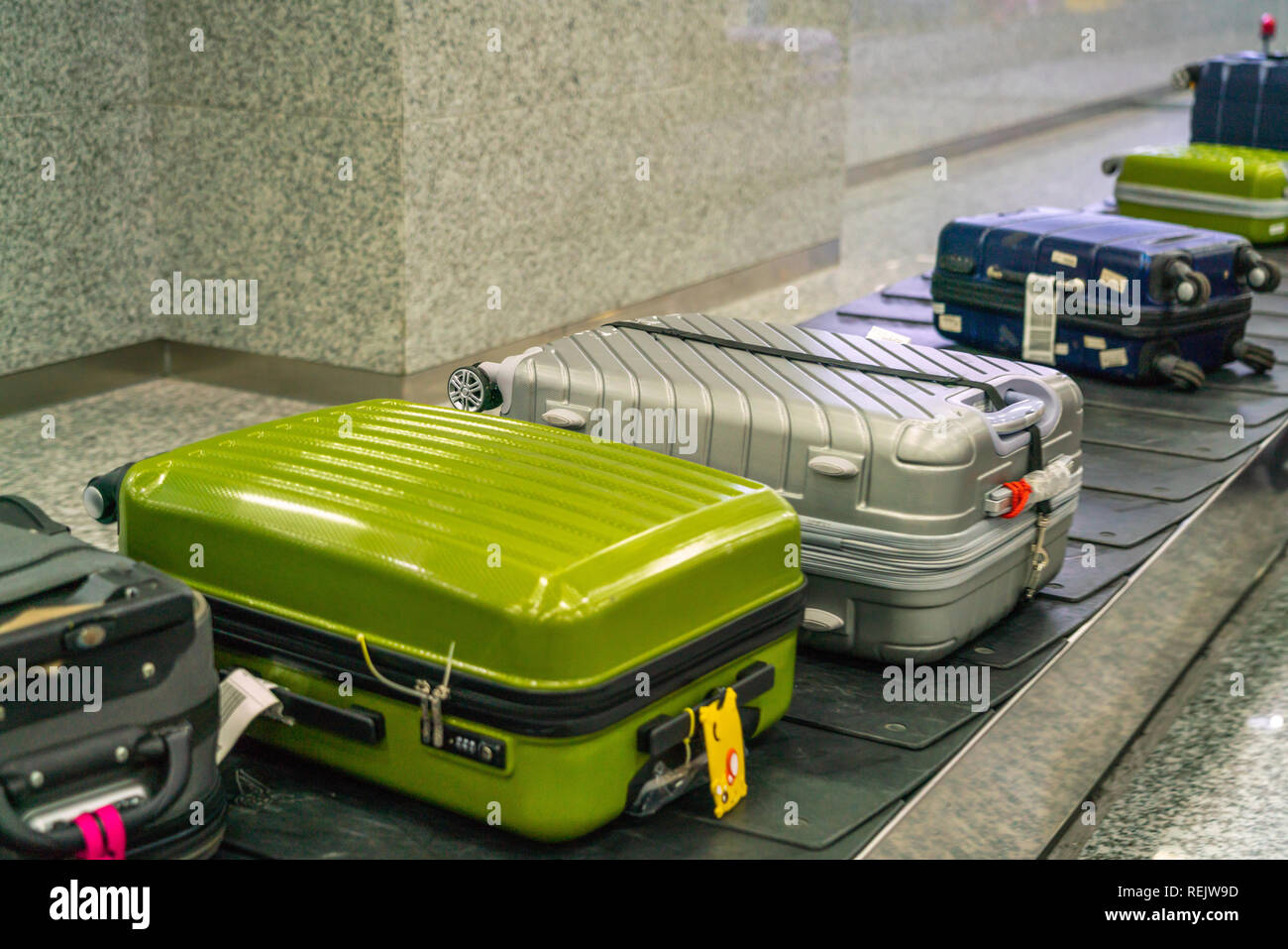 Suitcase and luggage on the conveyor belt in the international airport