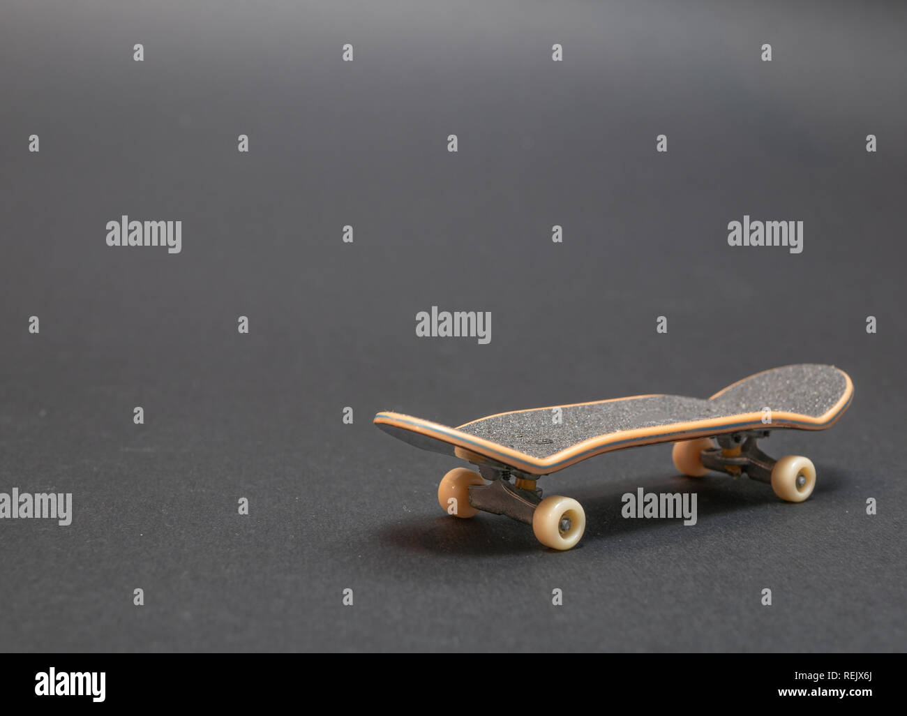 skateboard on dark black background. low key image Stock Photo Alamy