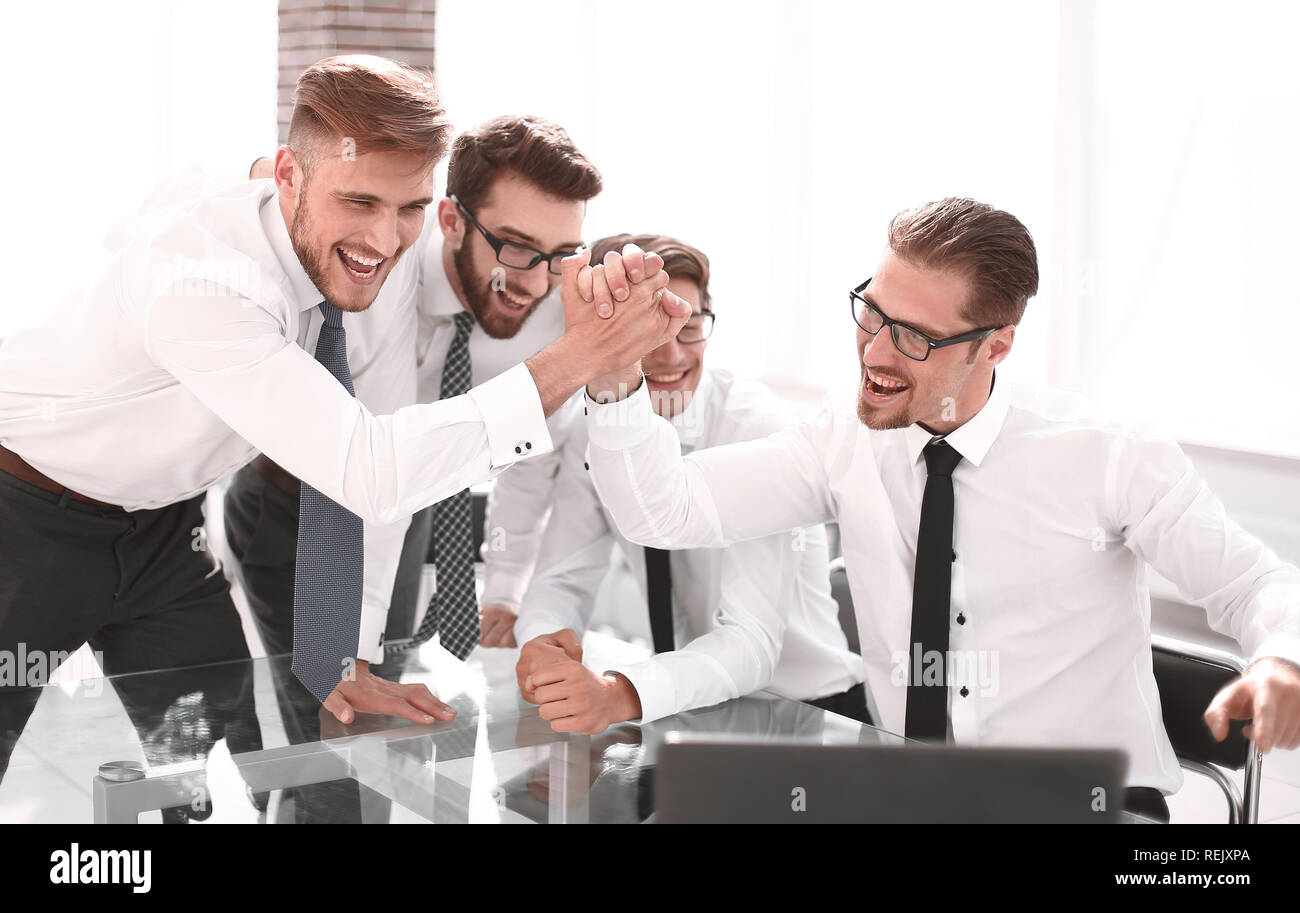 employees giving each other a high five Stock Photo - Alamy