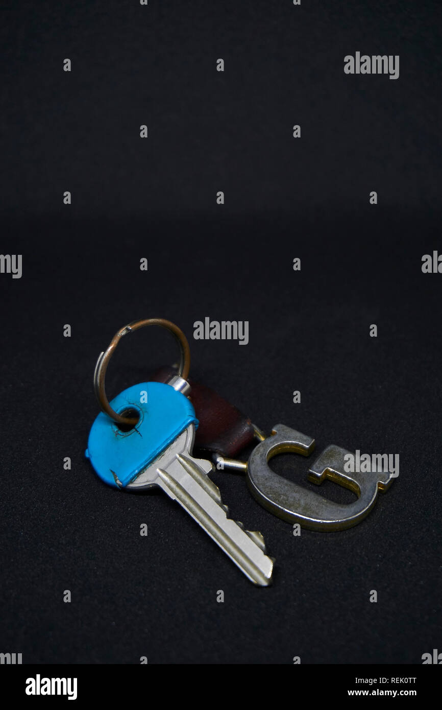 A blue key with keychains Stock Photo