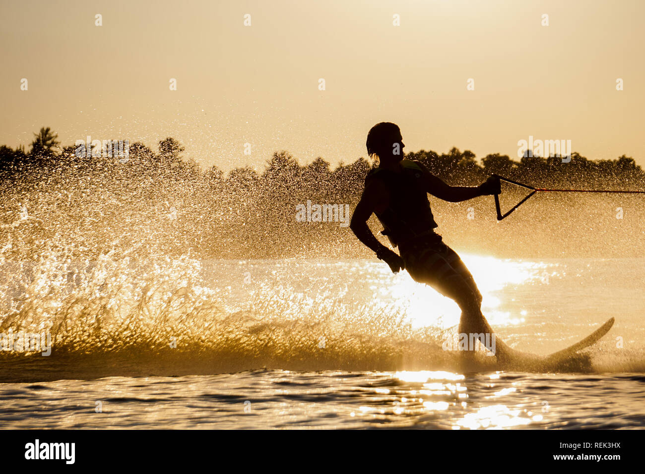 Water Skiing during sunset Stock Photo