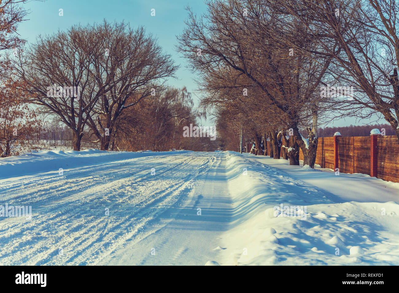 Snowy country road in winter sunny day Stock Photo - Alamy